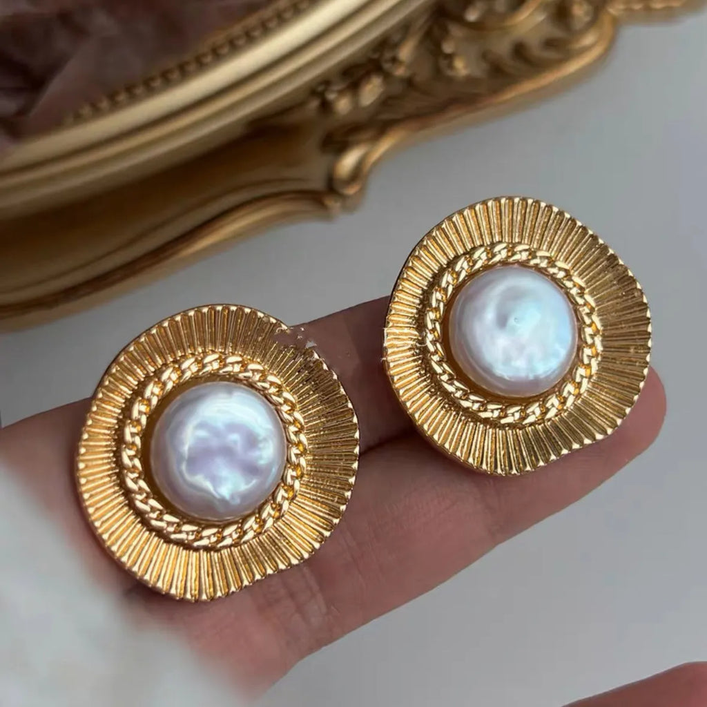 Gold round retro earrings for women with metal construction and circular design
