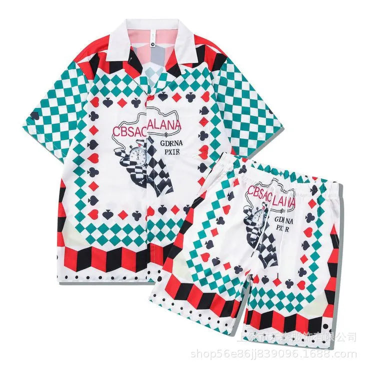 Men's plaid short-sleeve shirt and trouser beach outfit on a hanger.