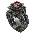 Women's geometric alloy ring with rose motif and zircon inlay, shown in rose gold, black rhinestone, and pink diamond electroplated finishes.