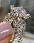 Geometric silver fashion ring for women on a hand, shown in both gold and white colour options.