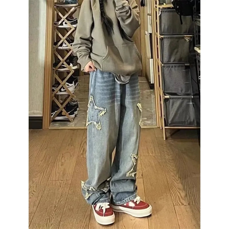 Blue women's high waist straight leg jeans on a neutral background.
