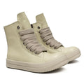 Black high-top leather sneakers with side zipper on a white background