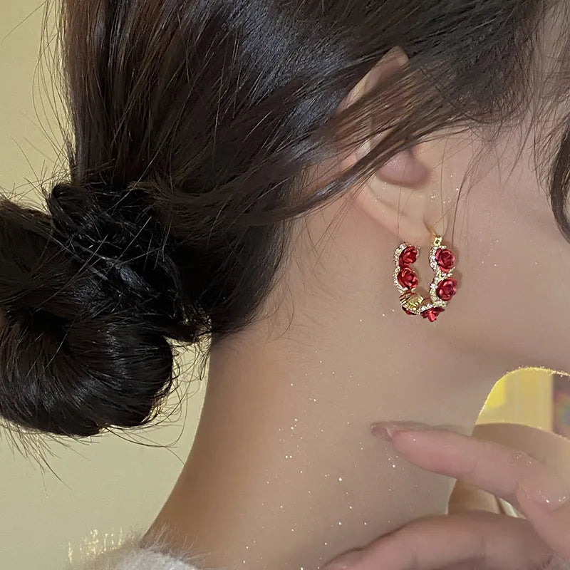 Red floral alloy clip earrings with rose design for women