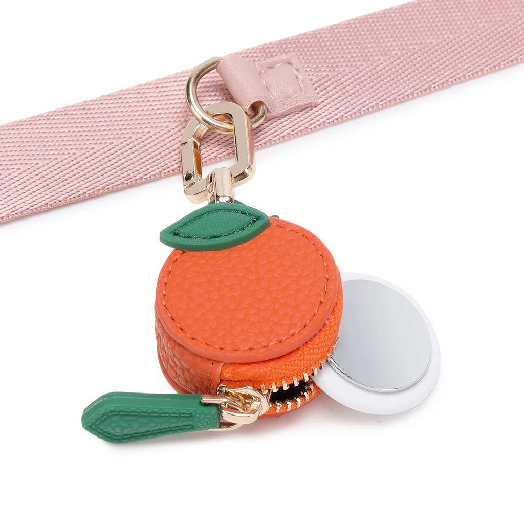 Mini leather coin purse keychain in cherry red colour with zippered closure and keychain attachment