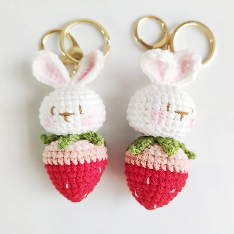 Colourful hand-woven wire rabbit strawberry pendant on a keyring