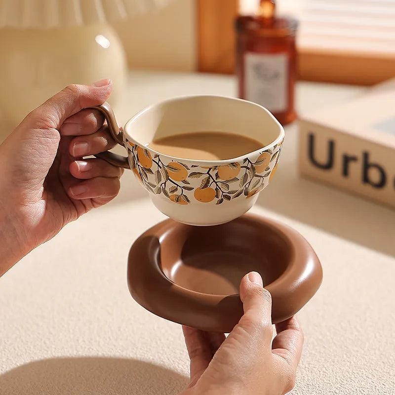 Antique-style ceramic coffee cup and saucer set with 210ml capacity in black or orange retro designs.