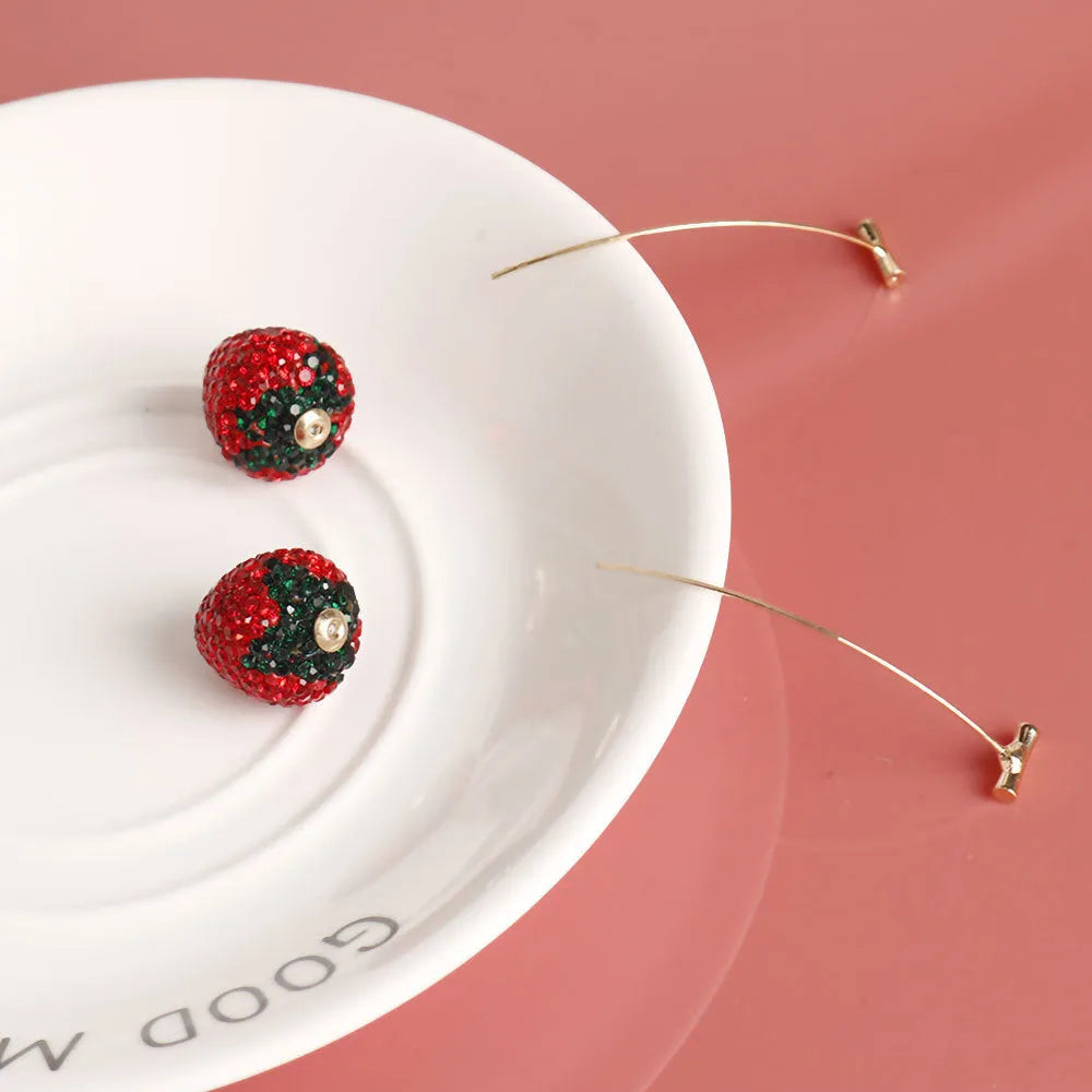 Geometric strawberry-shaped zinc alloy earrings in spot drill red finish.