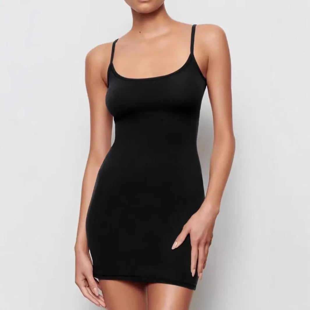 Black sleeveless sling style sheath dress with a slim fit and short mini skirt length.