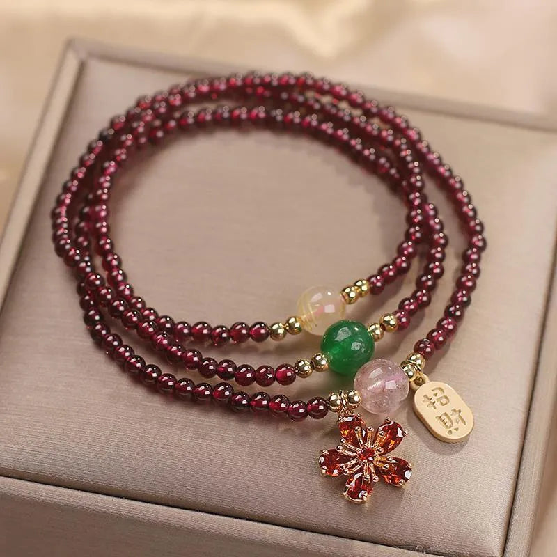 Natural crystal bracelet in pomegranate red and cherry blossom colours with sequin bead accents for women