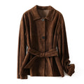Yellow brown women's mid-length cashmere coat with Peter Pan collar and leather belt on a hanger.