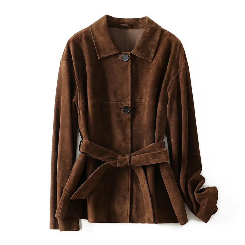 Yellow brown women's mid-length cashmere coat with Peter Pan collar and leather belt on a hanger.