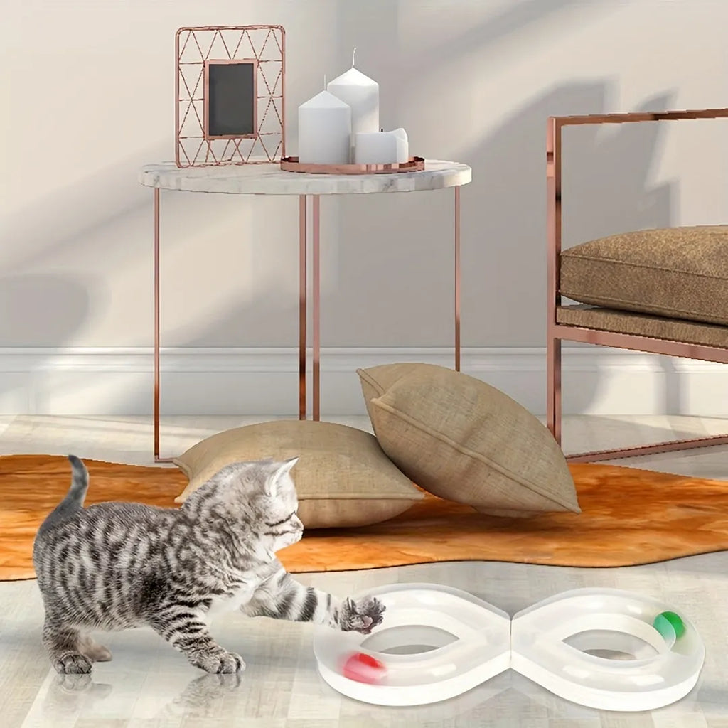 Blue and white plastic cat turntable track toy with balls and a feather teaser wand.
