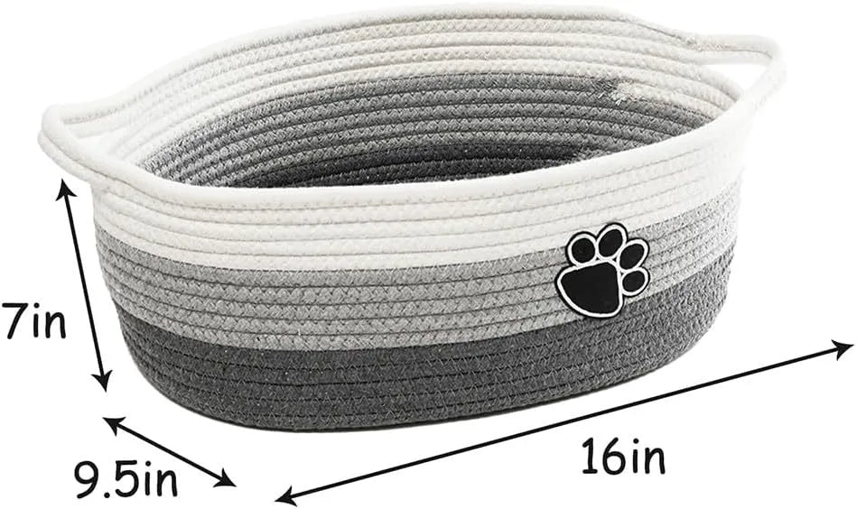 Small light beige woven cotton rope storage basket with a wooden handle.