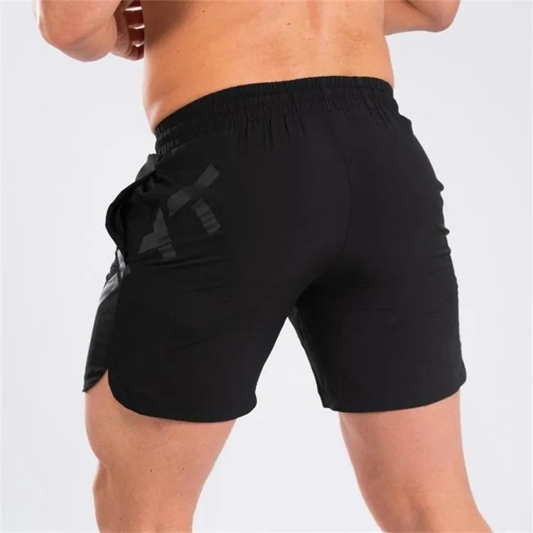 Men's black elastic knee-length training shorts with quick-drying fabric