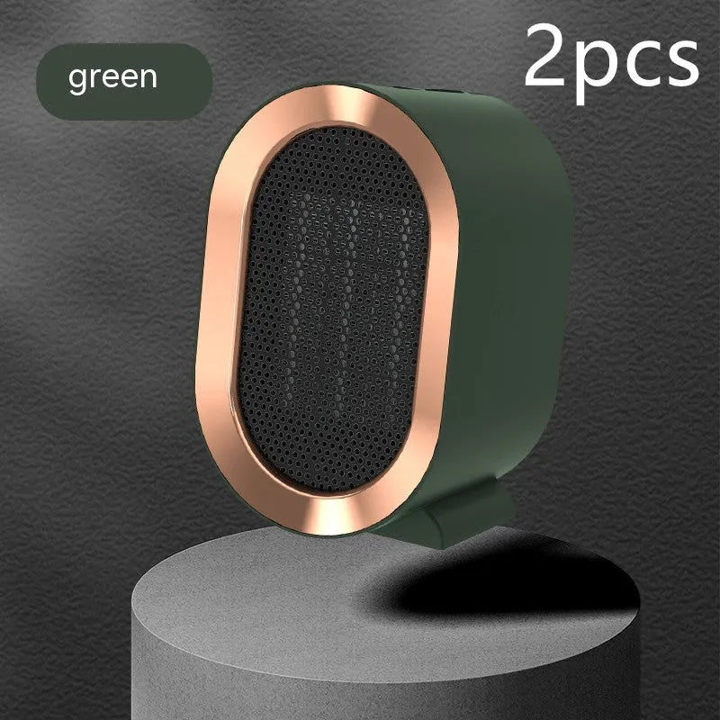 Desktop electric ceramic heater in black on a wooden desk