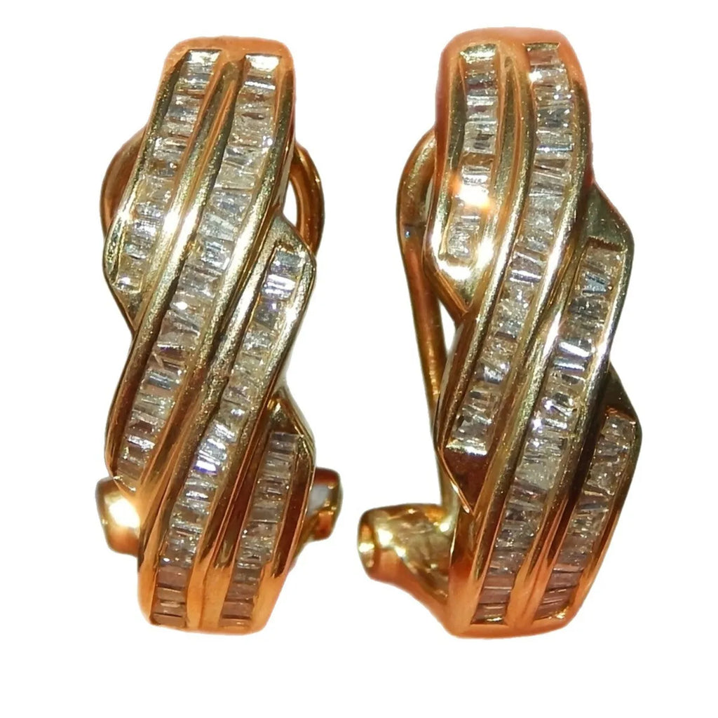 A pair of gold-coloured geometric earrings made from copper with a round design element.