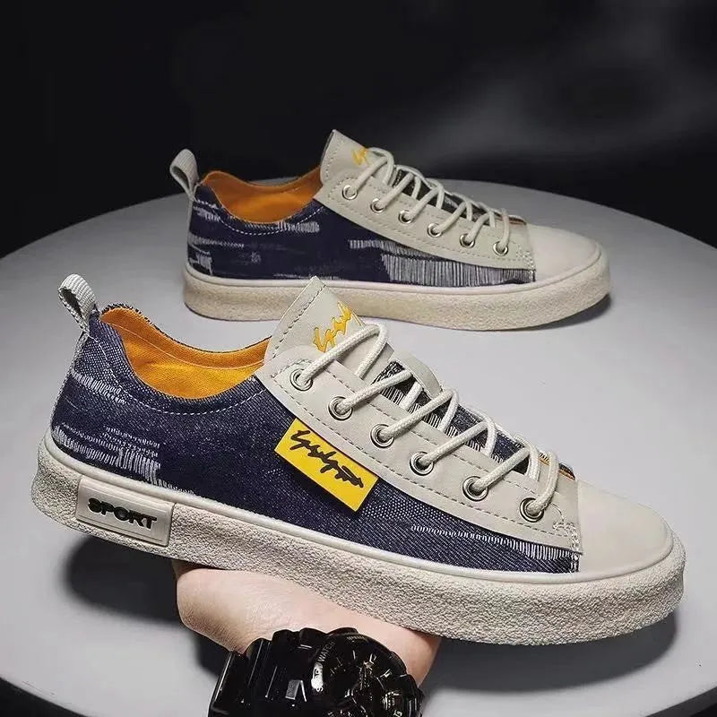 Men's dark blue canvas lace-up shoes with a round toe and white rubber sole on a neutral background.