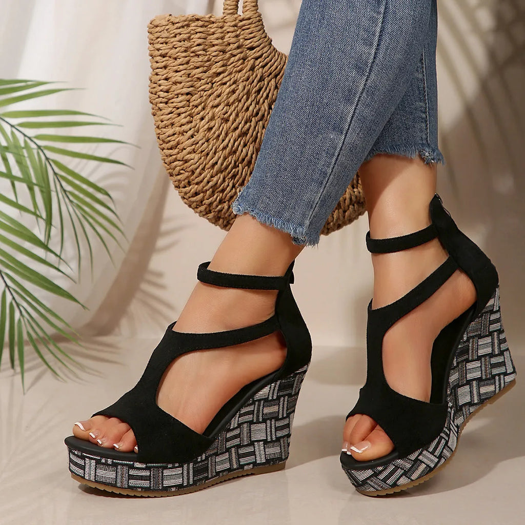 Women's cream white ankle-strap buckle sandals with thick rubber sole and cloth upper.