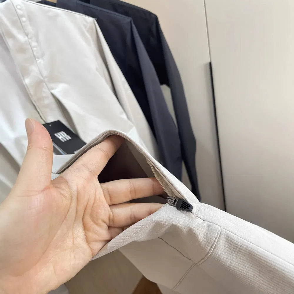 Men's beige stand collar polyester casual jacket with long sleeves and straight hem.