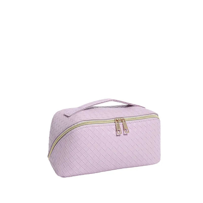 Waterproof large capacity PU storage bag in white, open showing cosmetics inside