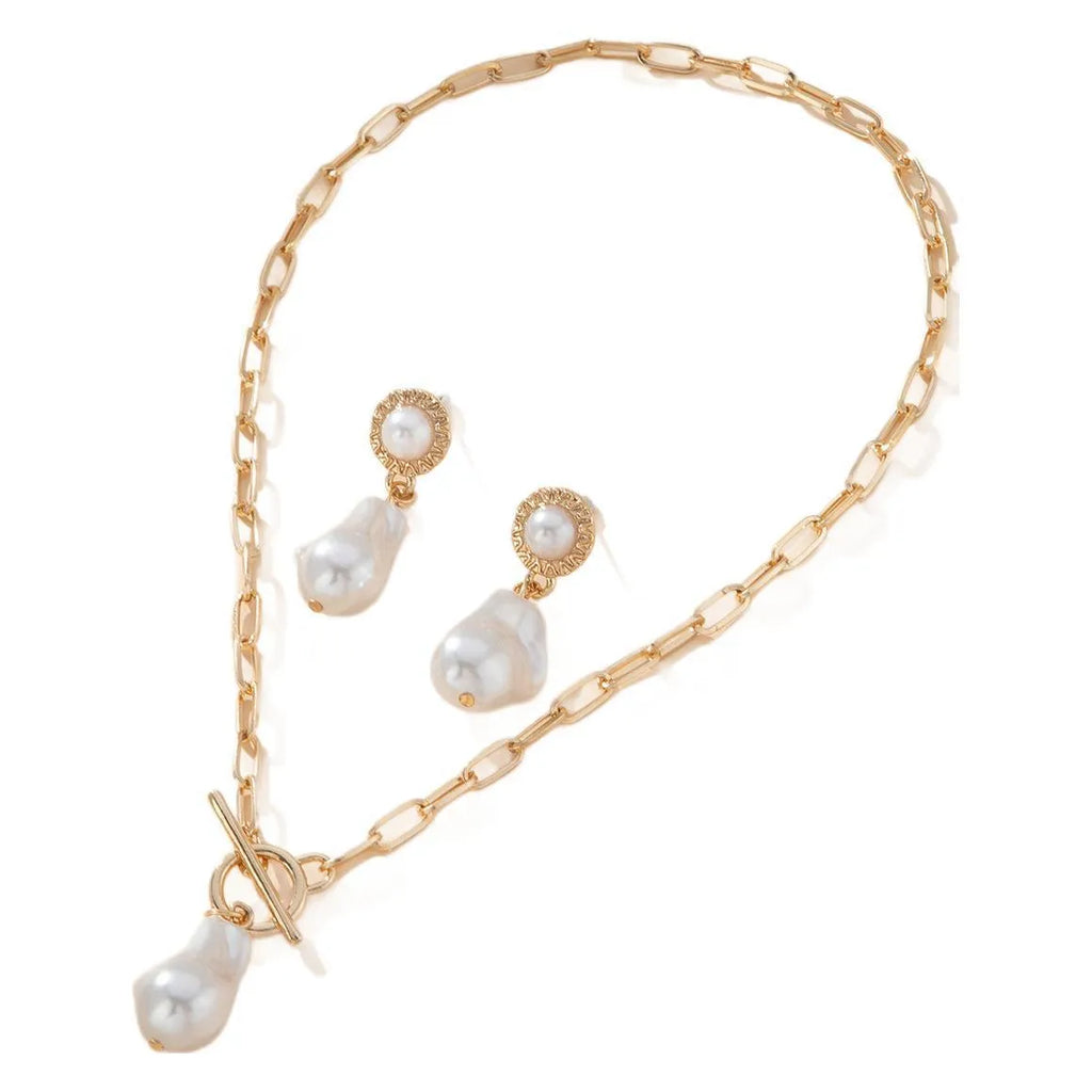 Gold colour baroque pearl necklace and earring set with retro design on dark background