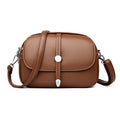 Soft black oval crossbody shoulder bag for women with visible stitching and a shoulder strap.