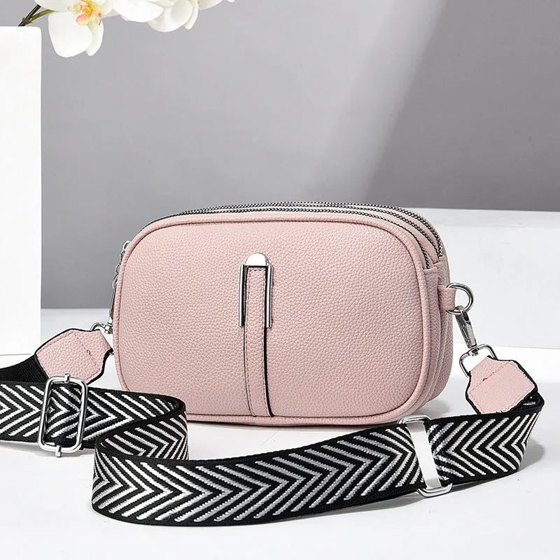 Soft PU leather women's oval crossbody bag showing slit pocket and internal organiser compartments