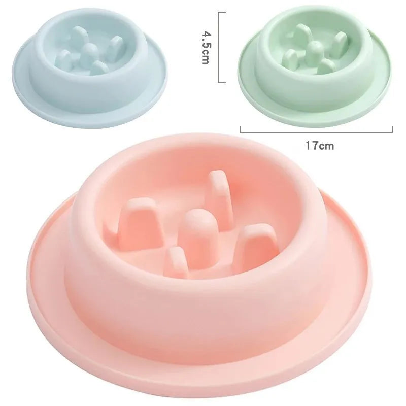 Blue pet slow feeder bowl with maze pattern and non-slip base on a kitchen floor