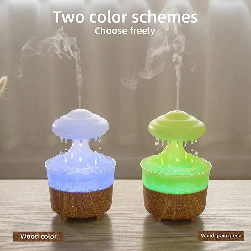 Wood grain white cloud-shaped humidifier and essential oil diffuser with coloured LED night light on a table.