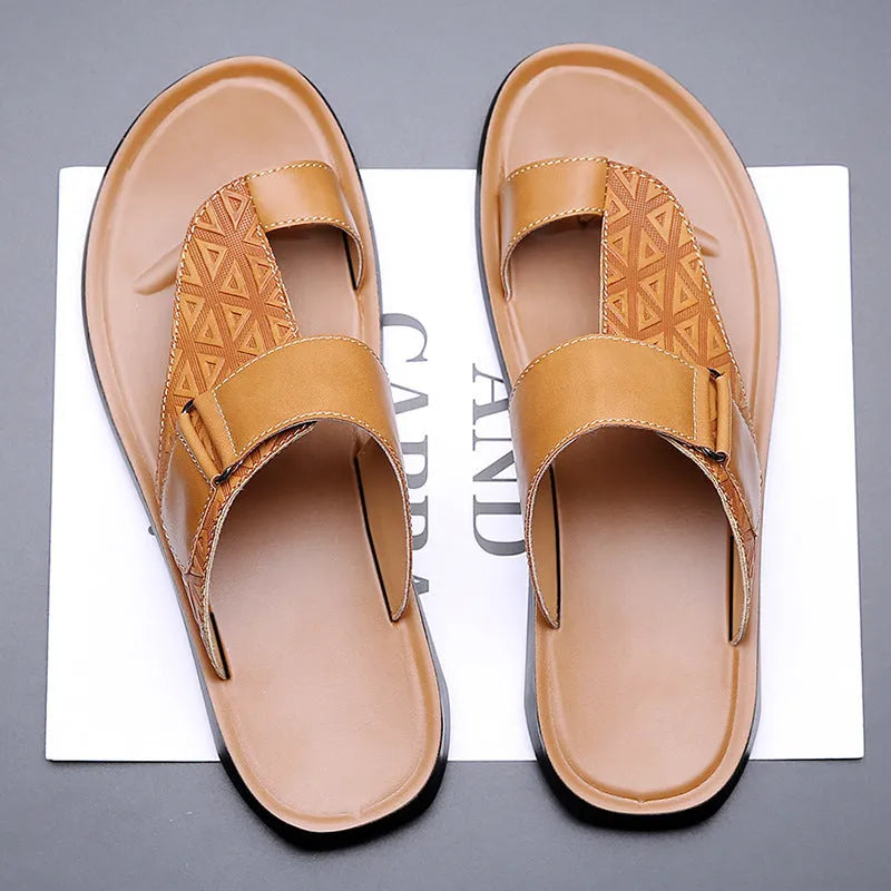 Men's light brown open-toe beach slippers made of cowhide with a rubber sole, shown on a neutral background.