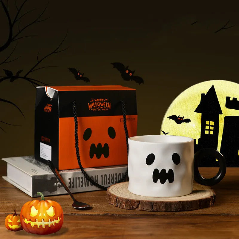 Orange ceramic Halloween pumpkin mug with handle and dessert spoon in gift box packaging