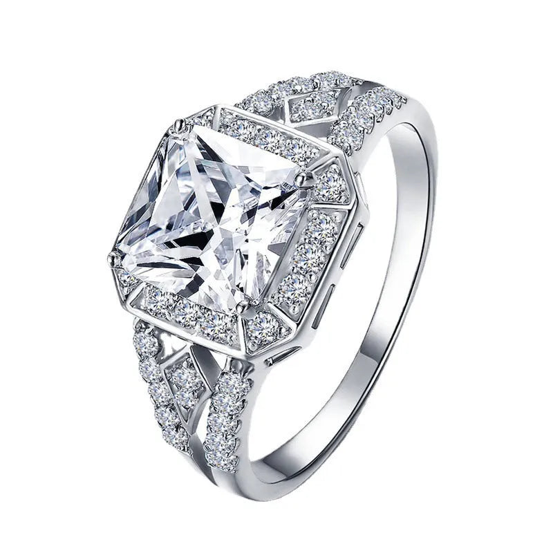 Geometric hollow design zircon ring with platinum colour finish on copper band
