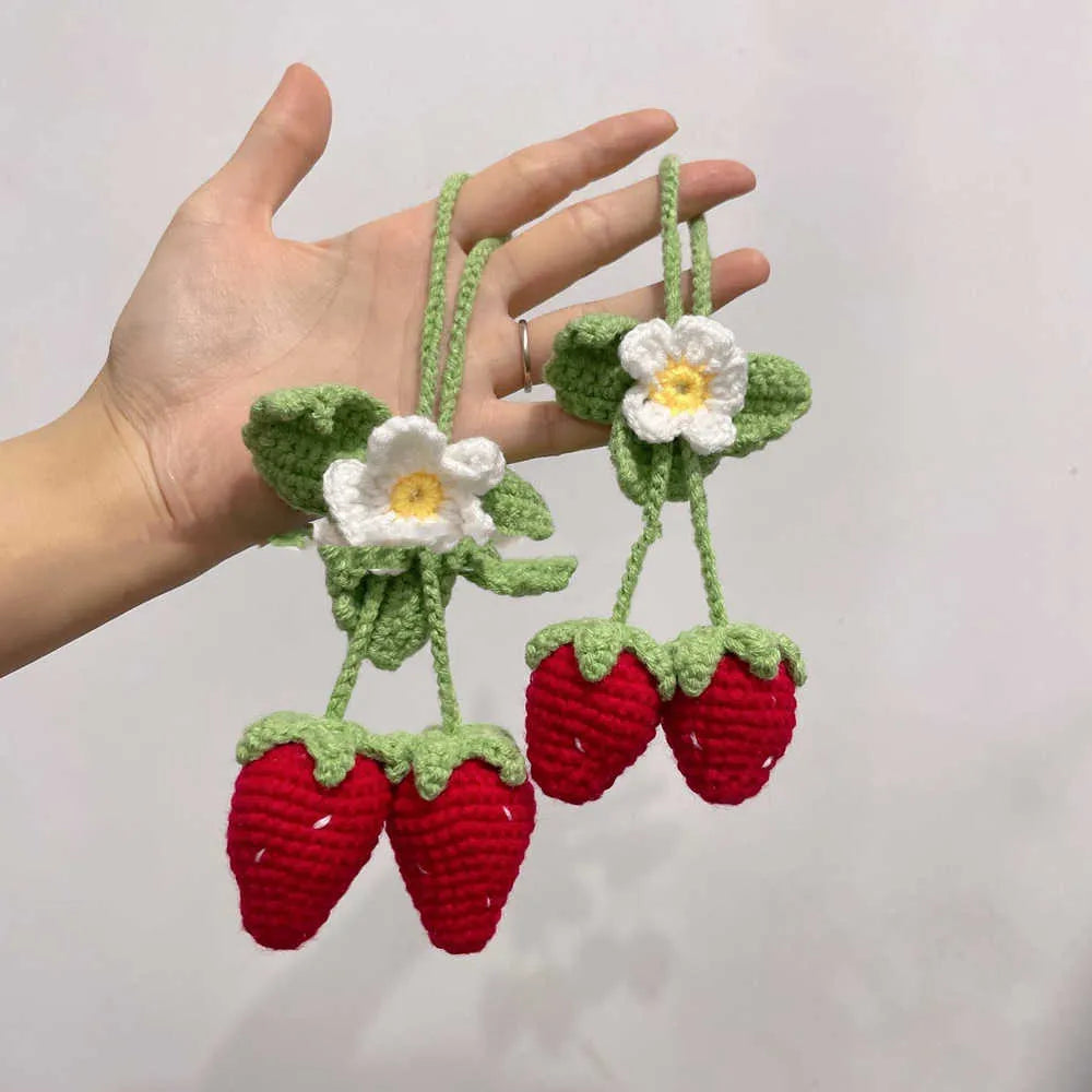 Handmade strawberry-shaped weaving pendant for car decoration made of cotton and hemp.