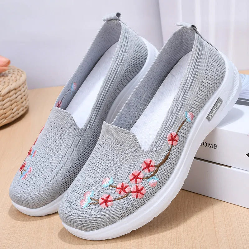 Women's wine red woven casual pumps with floral embroidery and a low anti-slip sole.