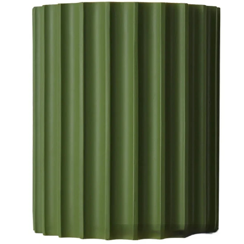 Nordic style wall light with a white macaron shell-shaped shade mounted on a hallway wall.
