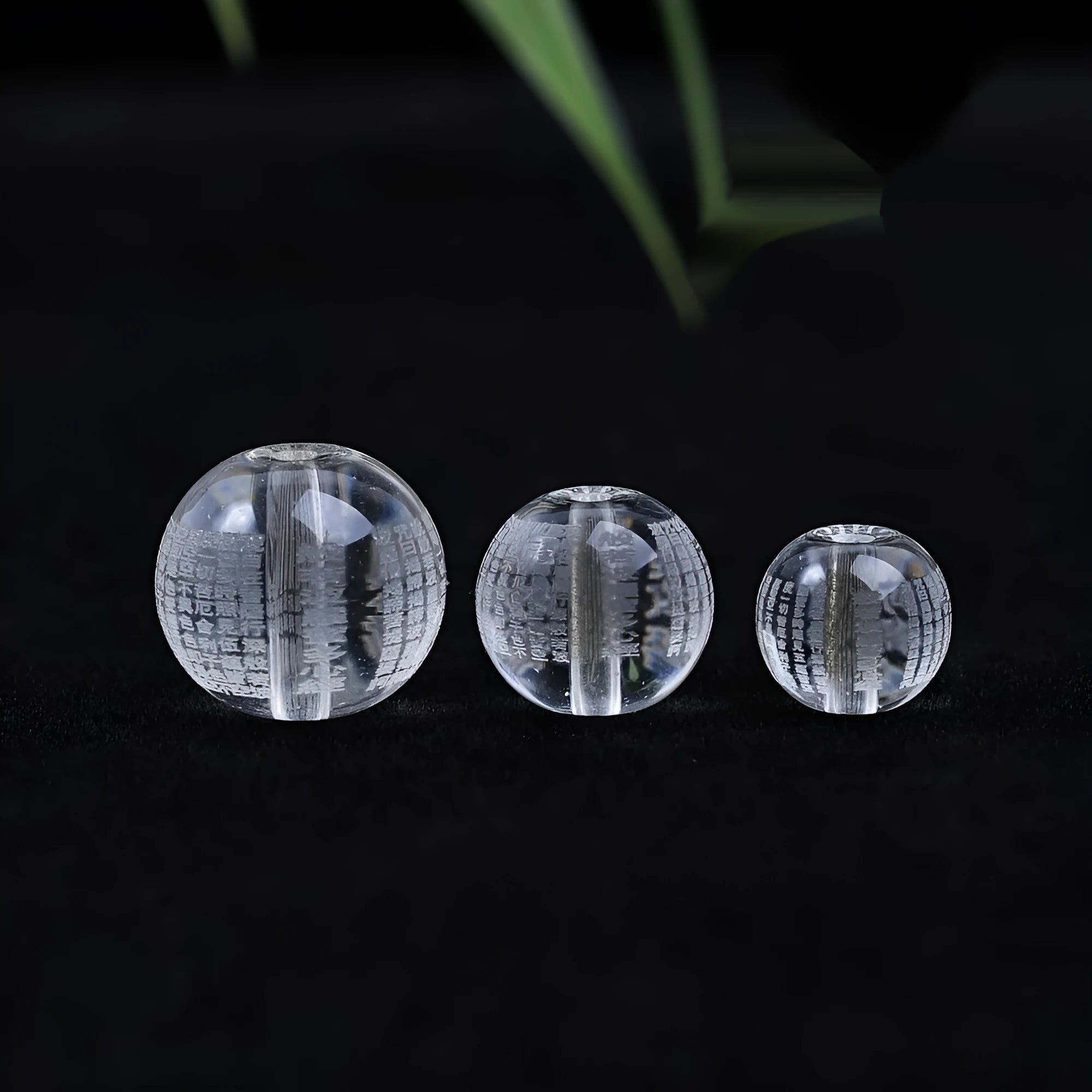 10mm glass Heart Sutra beads with polished surface showing clear script details