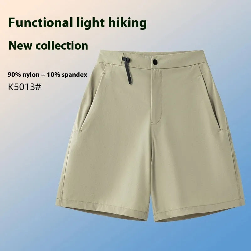 Men's quick-drying sports shorts in khaki colour with 3D cut and elastic waistband on a plain background.