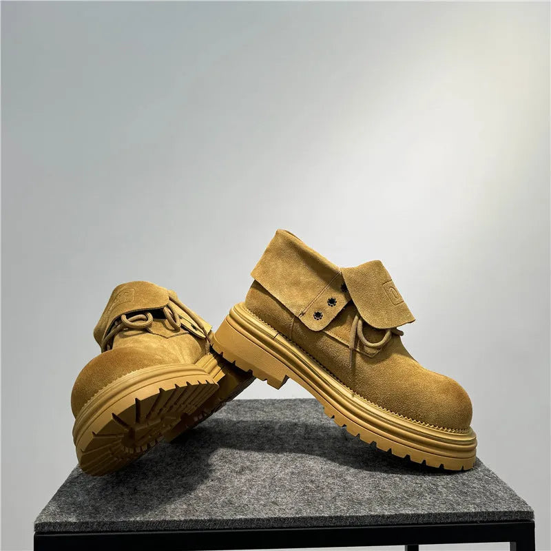 Distressed cow suede worker boots with thick soles and retro sewing detail in camel colour