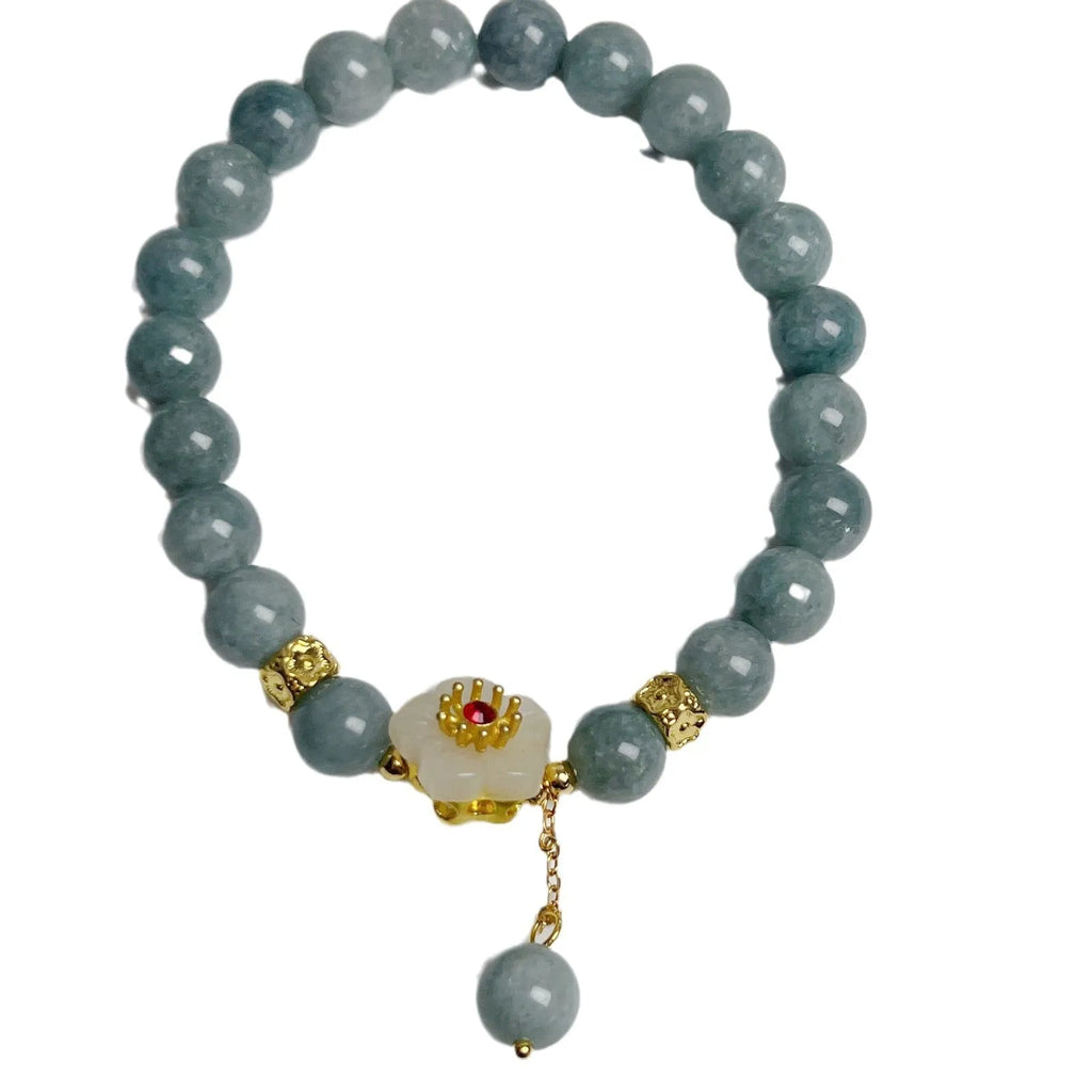 Women's retro style jade bracelet with adjustable rope closure on wrist