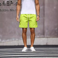 Men's loose-fitting army green workwear shorts made from cool silk cotton fabric.