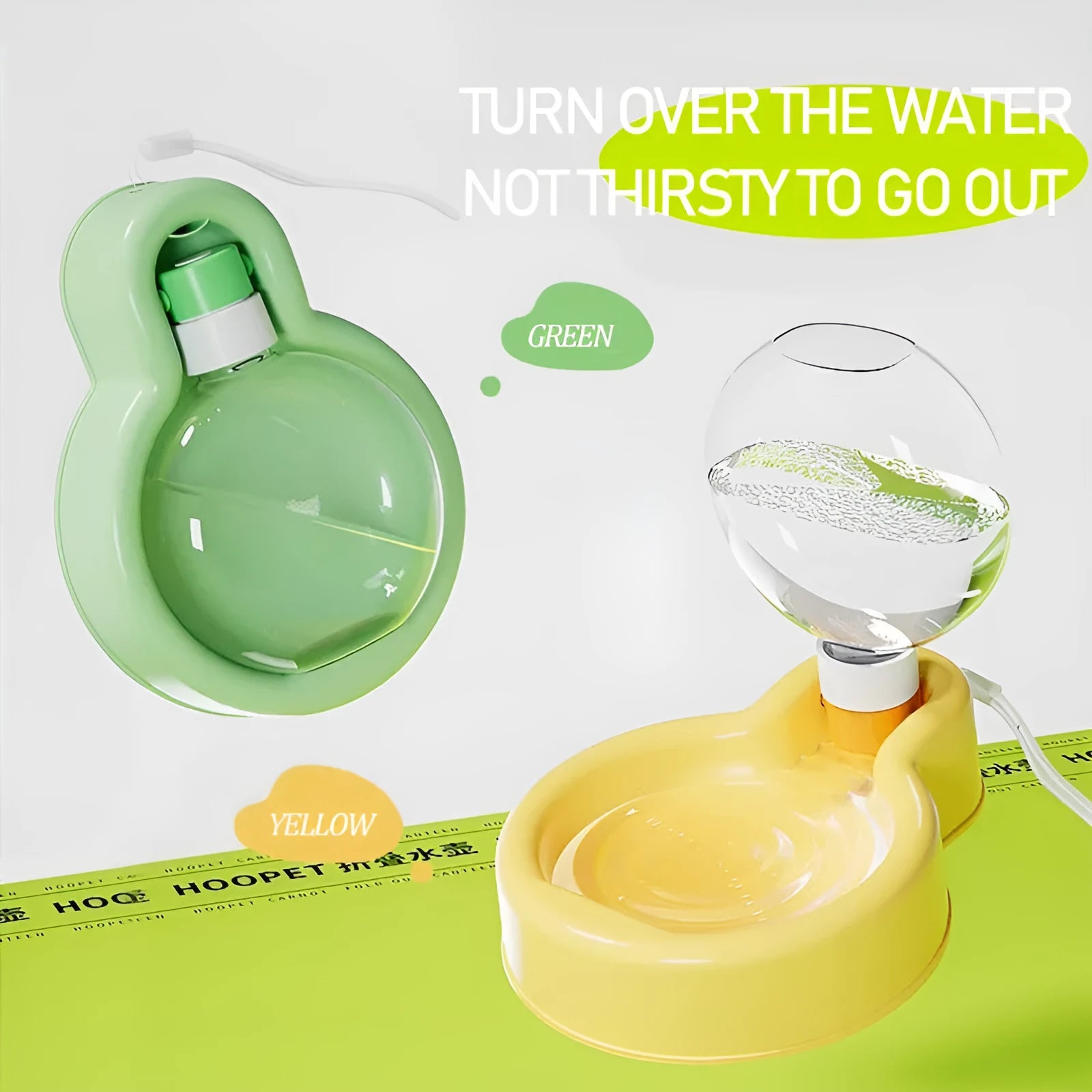 Green portable dog water bottle with pull-out drinking bowl on grass, showing travel cup design.