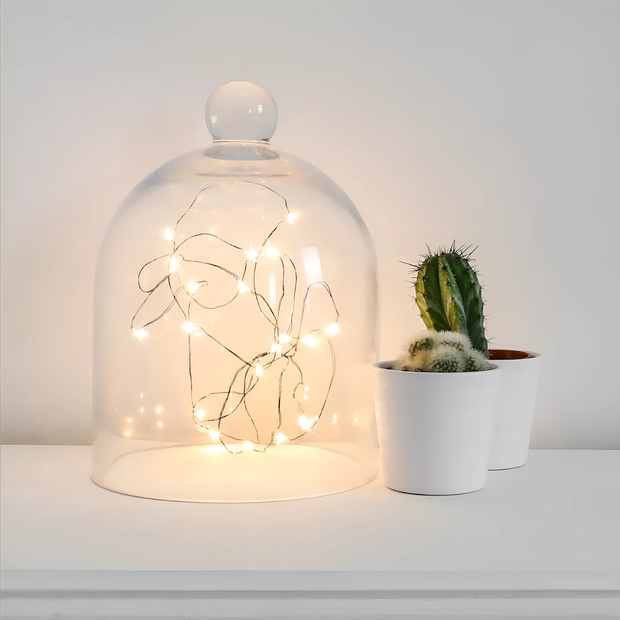 Copper wire LED fairy light string with 20 small button lights and a white plastic battery box.