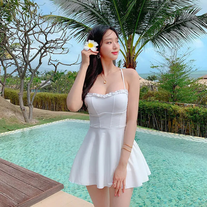 White women's one-piece swimsuit with hollow out design on mannequin