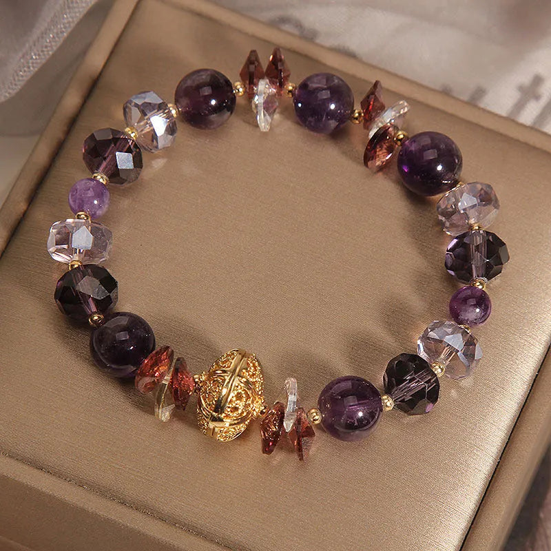 Purple crystal bracelet with pumpkin beads and rhinestone detailing on adjustable band