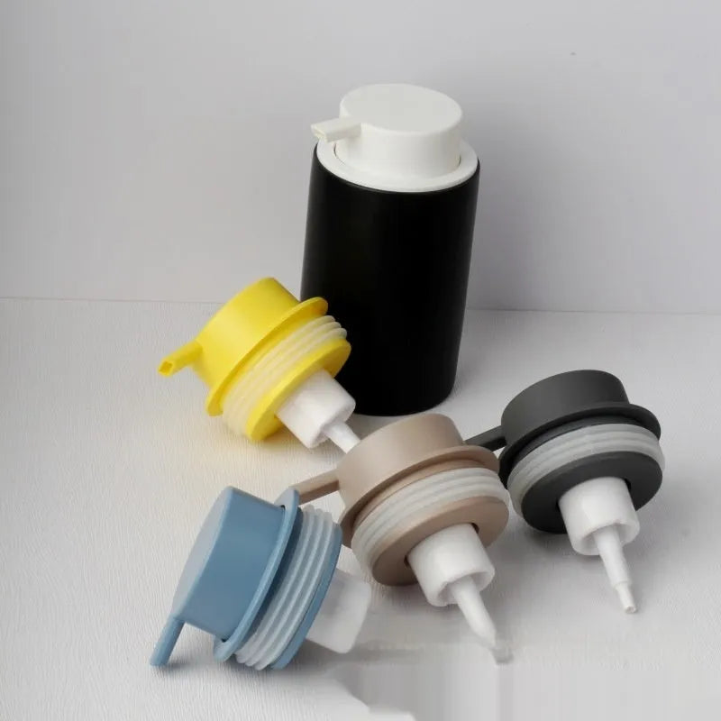 Large pump head facial cleanser foam bottle in metallic gold, silver, or matte black colour options