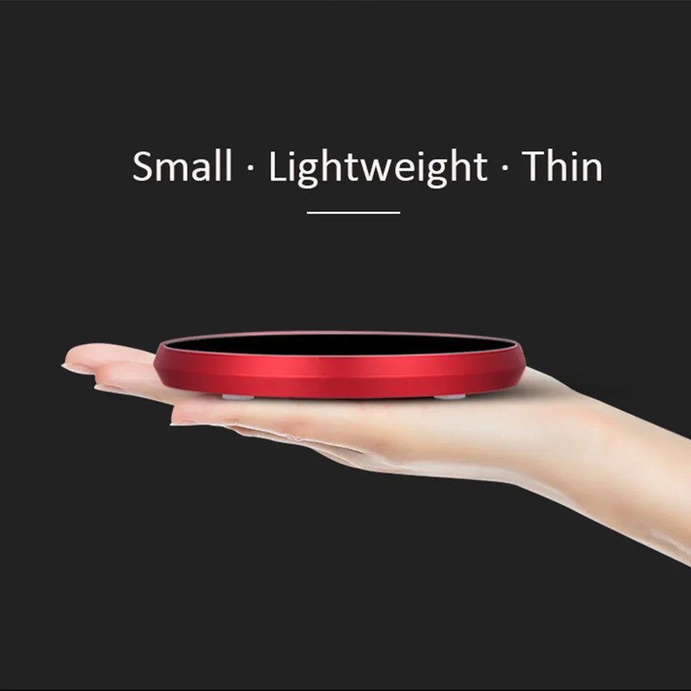 Black USB heating coaster for warming cups of coffee or tea on a desk