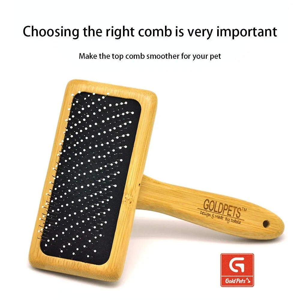 Goldpets bamboo handle pet slicker brush with stainless steel pins on wooden surface