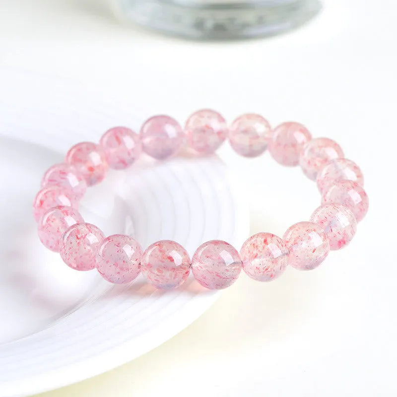 Strawberry quartz crystal ball bracelet with geometric beads measuring 10-10.8mm