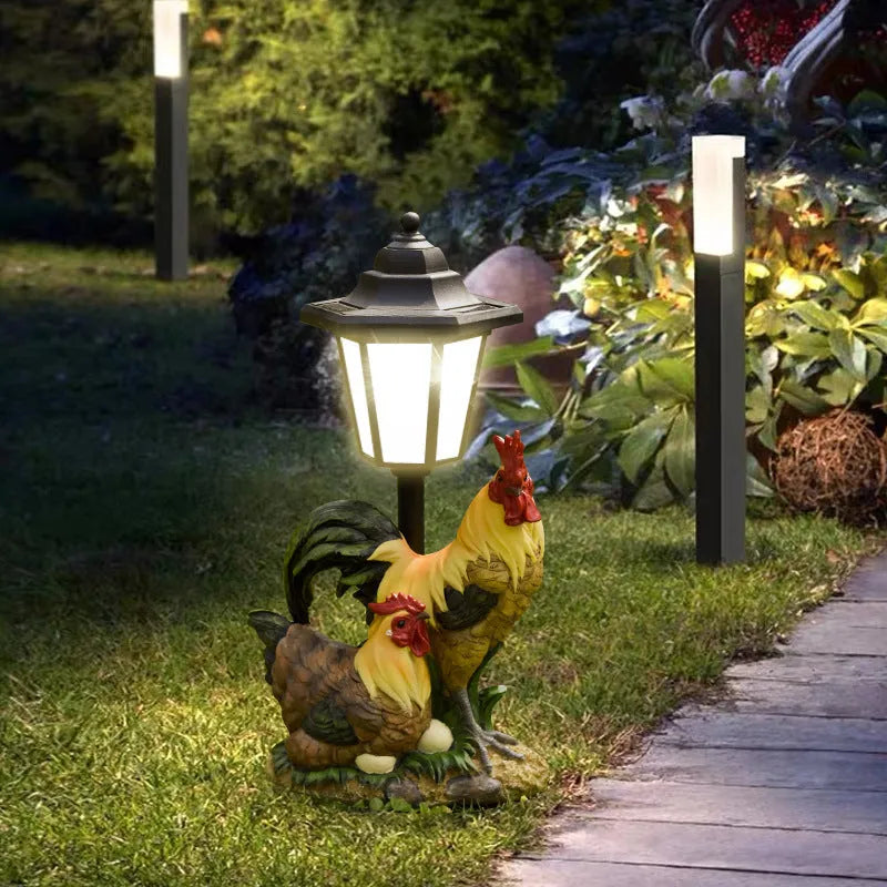Hexagonal solar garden lamp with decorative resin animal design on grass