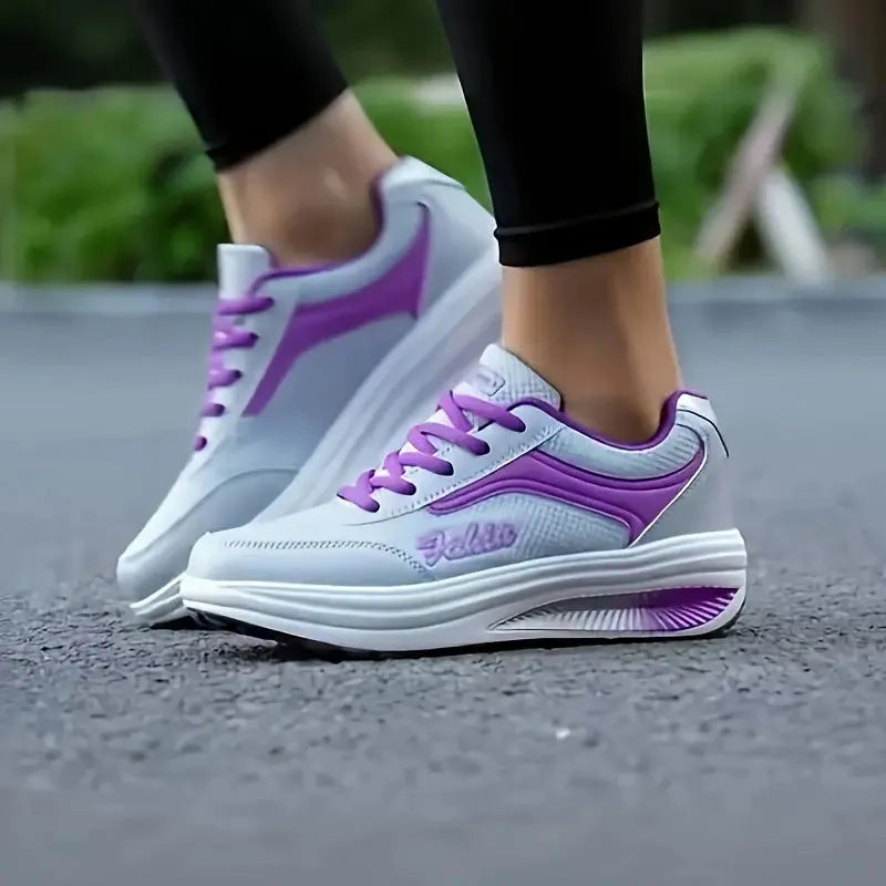 Women's mid-heel sports travel shoes in grey powder colour showing heelless design and single shoe construction